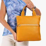 Sunshine Small | Model wearing a convertible tote clutch crossbody