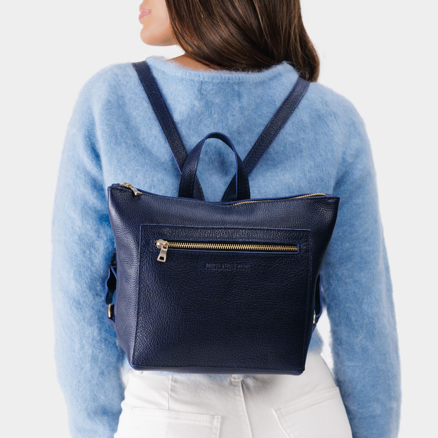 ANY | Person wearing Tote Backpack