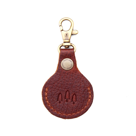 Nutmeg | Round leather AirTag holder with snap closure and swivel lobster claw clasp