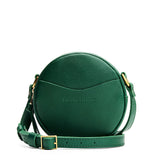 Bacalar | Circle shaped crossbody bag with top zipper and gold accents