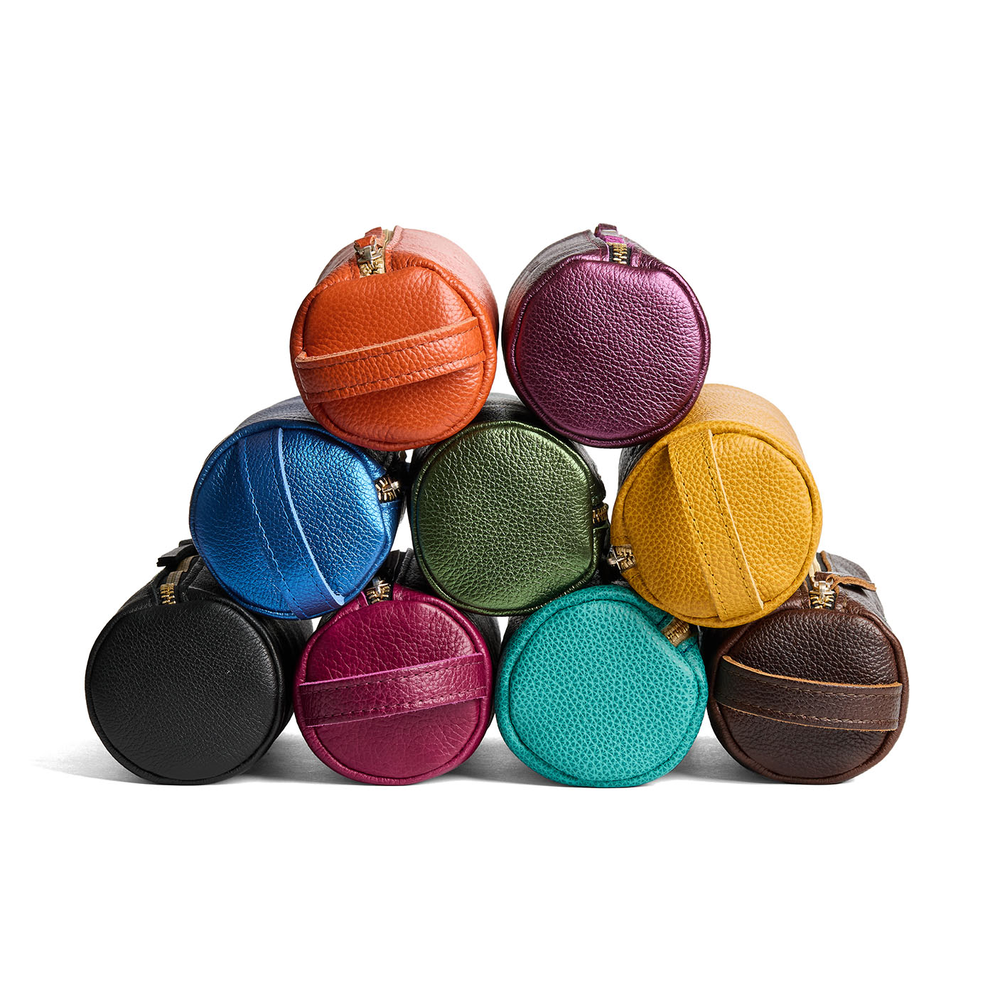 All Variants | Collection of cylindrical leather pouches with zippers and handles