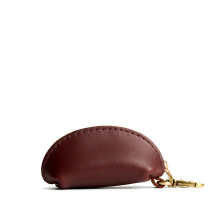 Cognac | Taco shaped leather pouch with zipper and swivel lobster clasp on white background