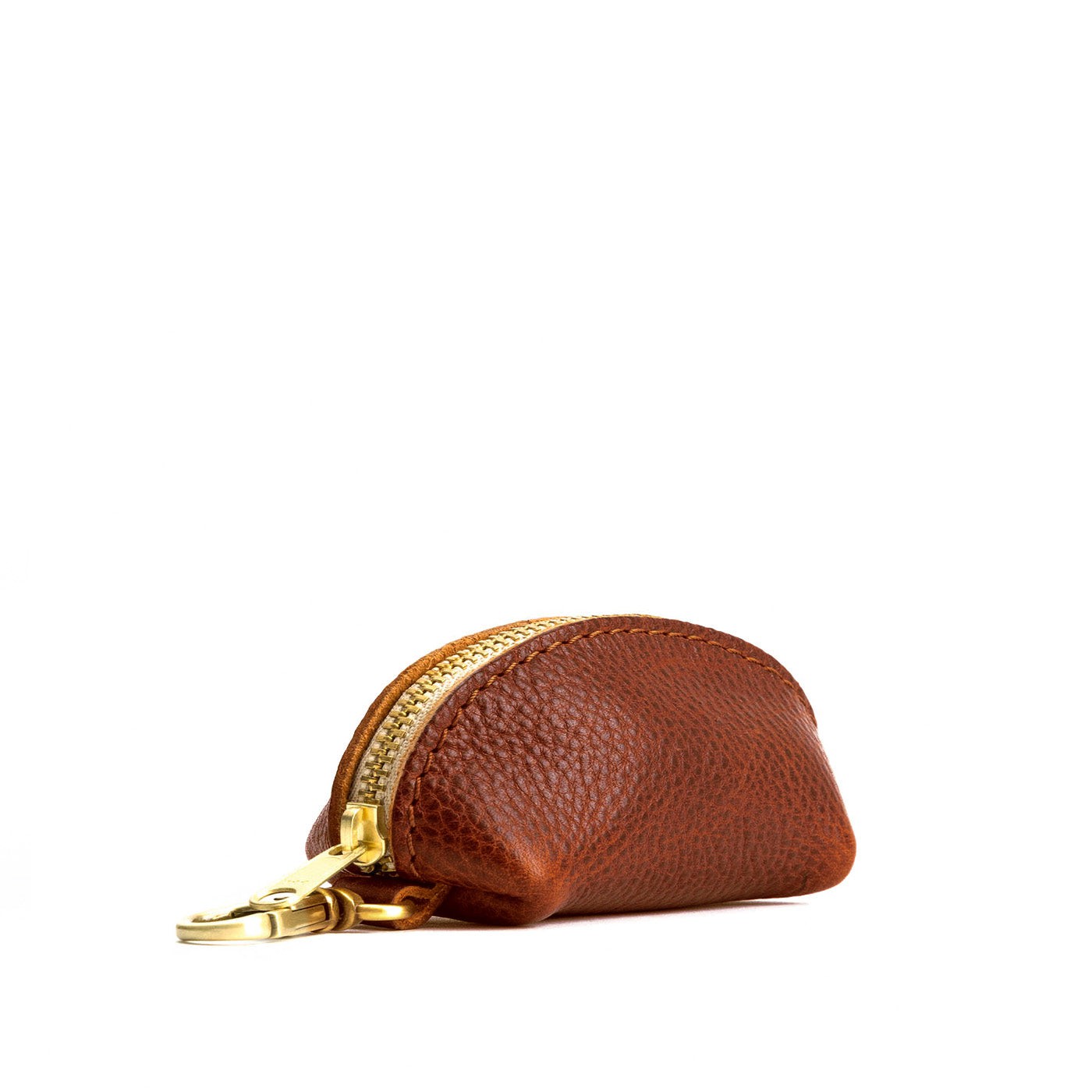 Nutmeg | Taco shaped leather pouch with zipper and swivel lobster clasp on white background