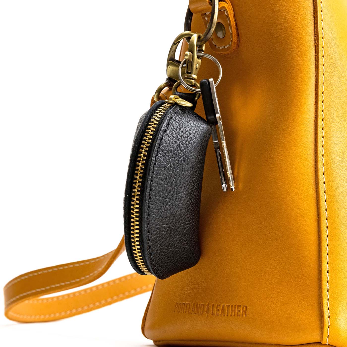 Pebbled--black | Taco shaped leather pouch with zipper and swivel lobster clasp on bag