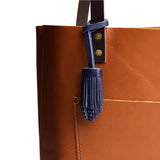 All Color: Cobalt | Pom-pom style with tiered leather fringe