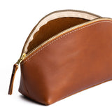 Honey | Spacious leather makeup bag with curved seams and top zipper open