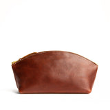 Nutmeg Total Eclipse | Spacious leather makeup bag with curved seams and top zipper