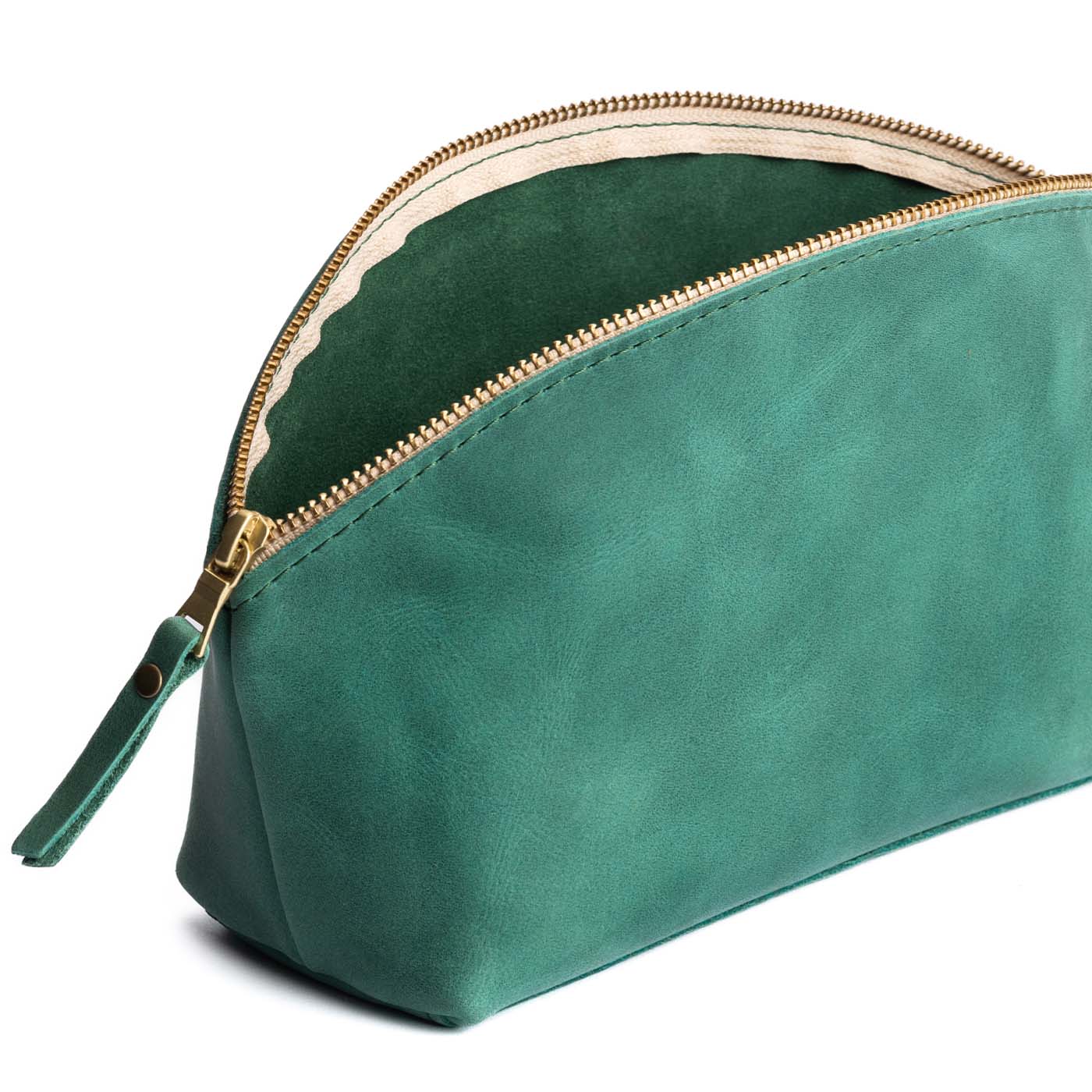 Surf | Spacious leather makeup bag with curved seams and top zipper open