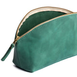 Surf | Spacious leather makeup bag with curved seams and top zipper open