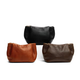 All Variants | Three leather makeup bags with folded sides and zipper closure