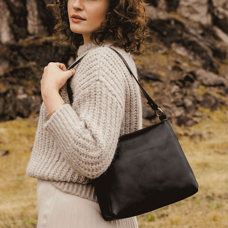 Black | Triangular shoulder bag with antiqued brass finished hardware