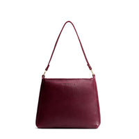 Cabernet*Small | Large triangular shoulder bag with antiqued brass finished hardware