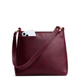 Cabernet Small | Large triangular shoulder bag with antiqued brass finished hardware