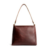 Cognac | Triangular shoulder bag with antiqued brass finished hardware