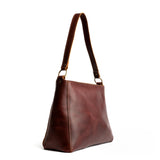 Cognac | Triangular shoulder bag with antiqued brass finished hardware