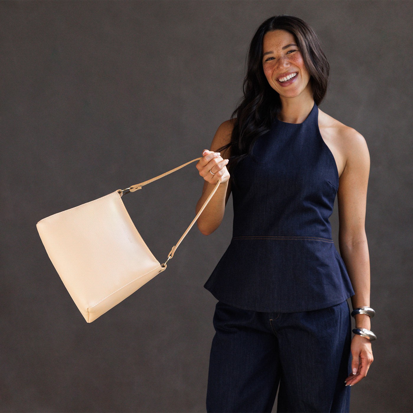 Moonflower | Triangular shoulder bag with antiqued brass finished hardware