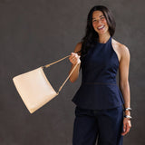 Moonflower | Triangular shoulder bag with antiqued brass finished hardware