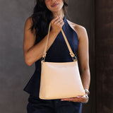 Moonflower | Triangular shoulder bag with antiqued brass finished hardware