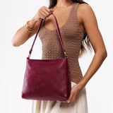 All Variants | Model holding Small Triangle Shoulder Bag