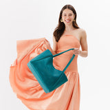 Aquarius Large | Model holding large rectangular tote bag
