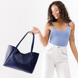 Cobalt Large | Model holding large rectangular tote bag