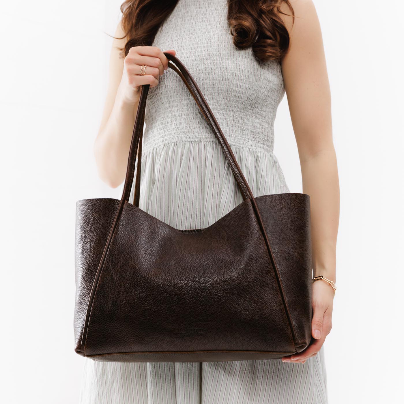 Coldbrew*Large | Model holding large rectangular tote bag
