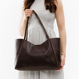 Coldbrew Large | Model holding large rectangular tote bag