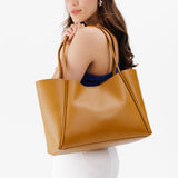 Mango Large | Model holding large rectangular tote bag
