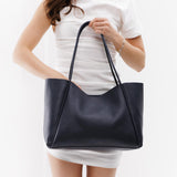 Night Owl Large | Model holding large rectangular tote bag