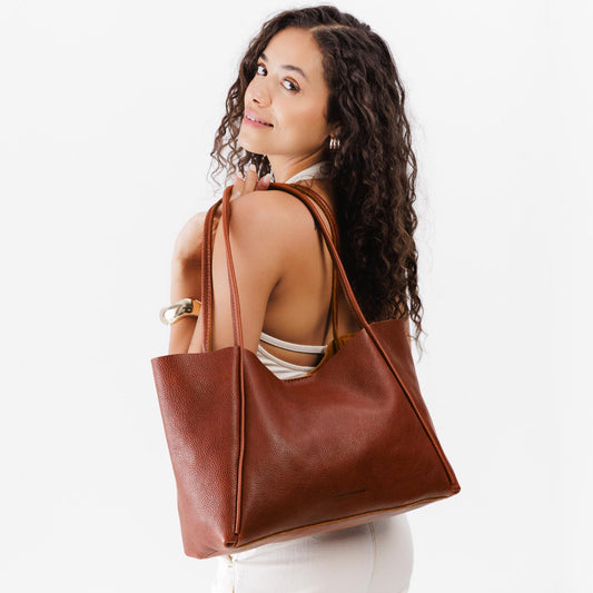 Nutmeg*Large | Model holding large rectangular tote bag