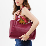 Orchid Large | Model holding large rectangular tote bag