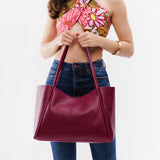 Orchid Large | Model holding large rectangular tote bag