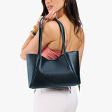 Boreal Medium | Woman carrying a wide tote with leather straps and snap closure
