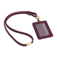 Plum | A leather lanyard attached to a matching card holder on a white background