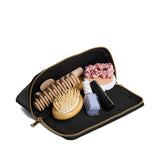 Pebbled--black | Triangular shaped pouch with extra long zipper