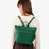 Bacalar | Model wearing a petite square slim leather tote backpack with zipper closure and adjustable straps