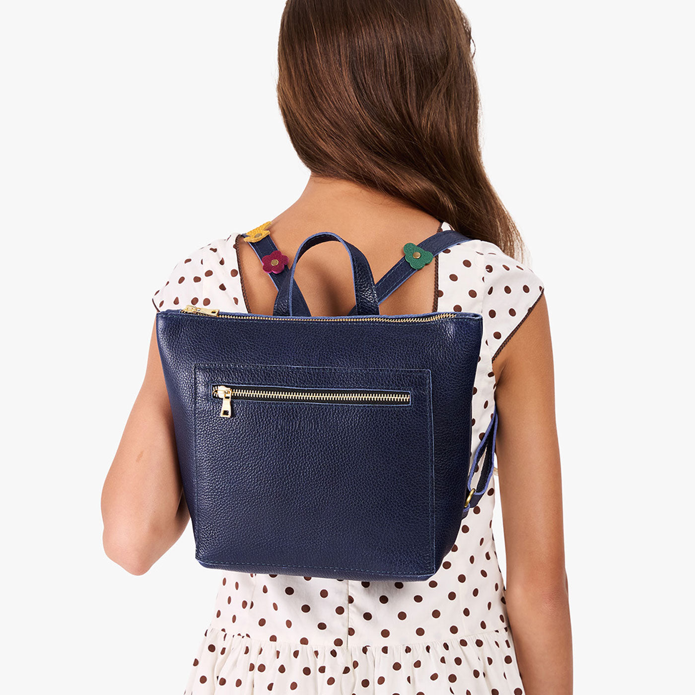 Cobalt | Model wearing a petite square slim leather tote backpack with zipper closure and adjustable straps