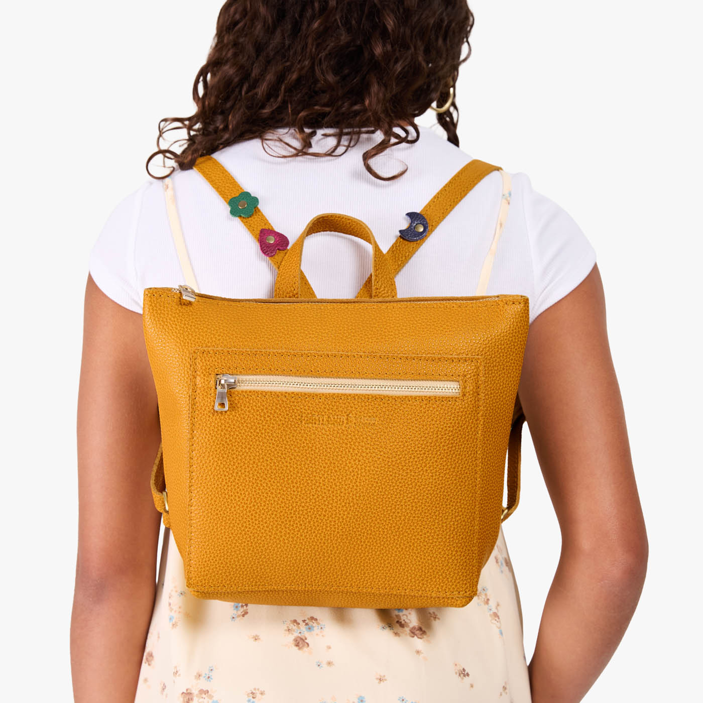 Sunshine | Model wearing a petite square slim leather tote backpack with zipper closure and adjustable straps