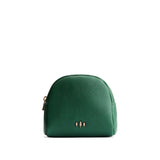 Bacalar | Curved top leather pouch with zipper opening, flat base, and three metal tree emblems in front