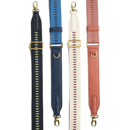 Black | Black strap with repeating tree pattern and brass-toned hardware