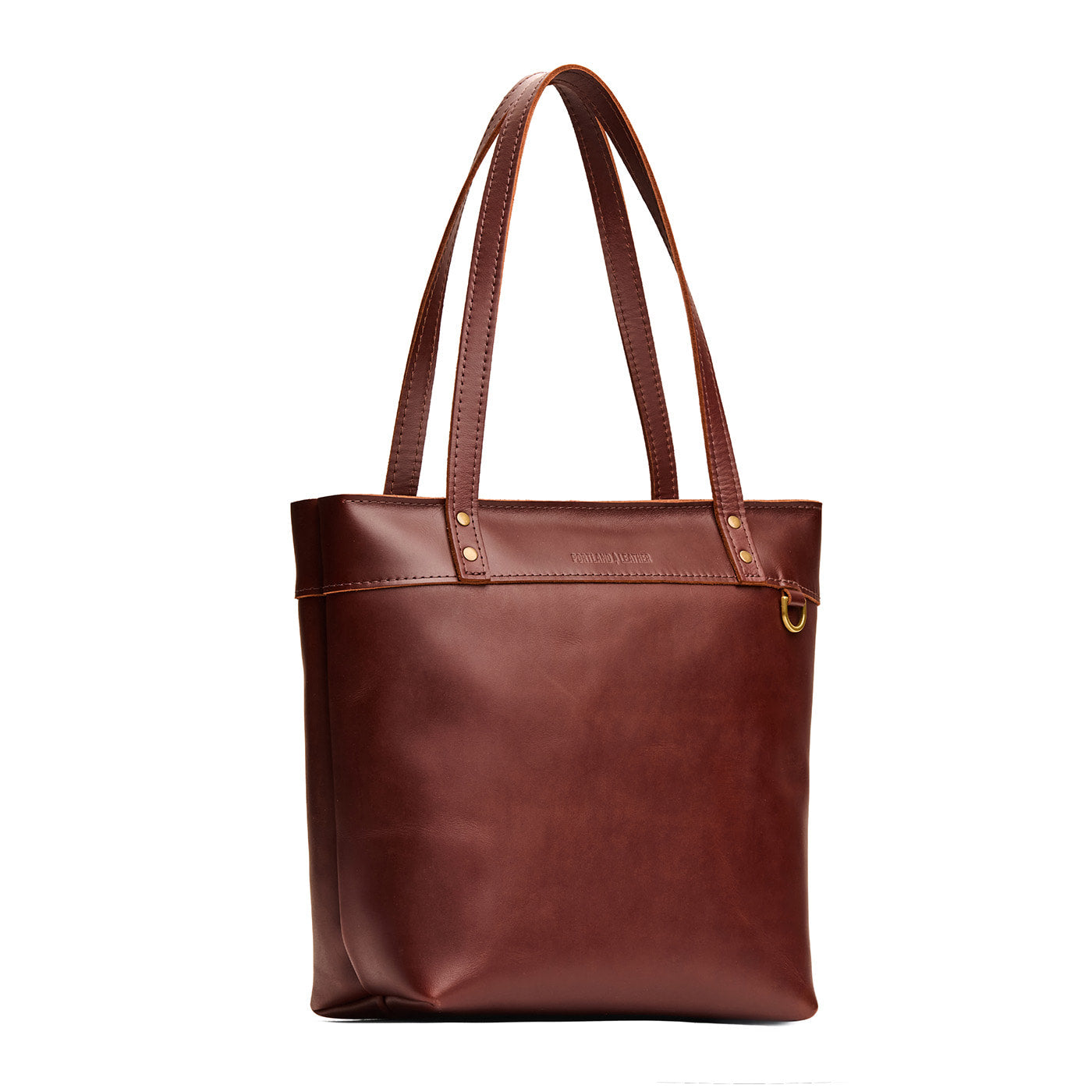 Cognac*Medium*Zipper | Model wearing leather tote bag with riveted straps and exterior key loop