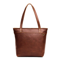 Nutmeg*Medium*Zipper | Model wearing leather tote bag with riveted straps and exterior key loop
