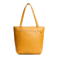 Sunshine*Medium*Zipper | Model wearing leather tote bag with riveted straps and exterior key loop