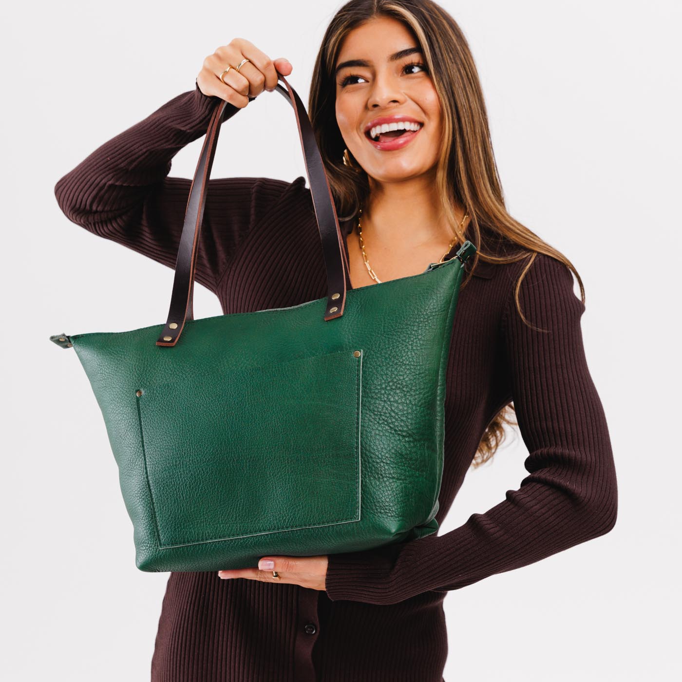 Bacalar*Zipper | Model holding large leather tote bag with sturdy bridle handles and front pocket