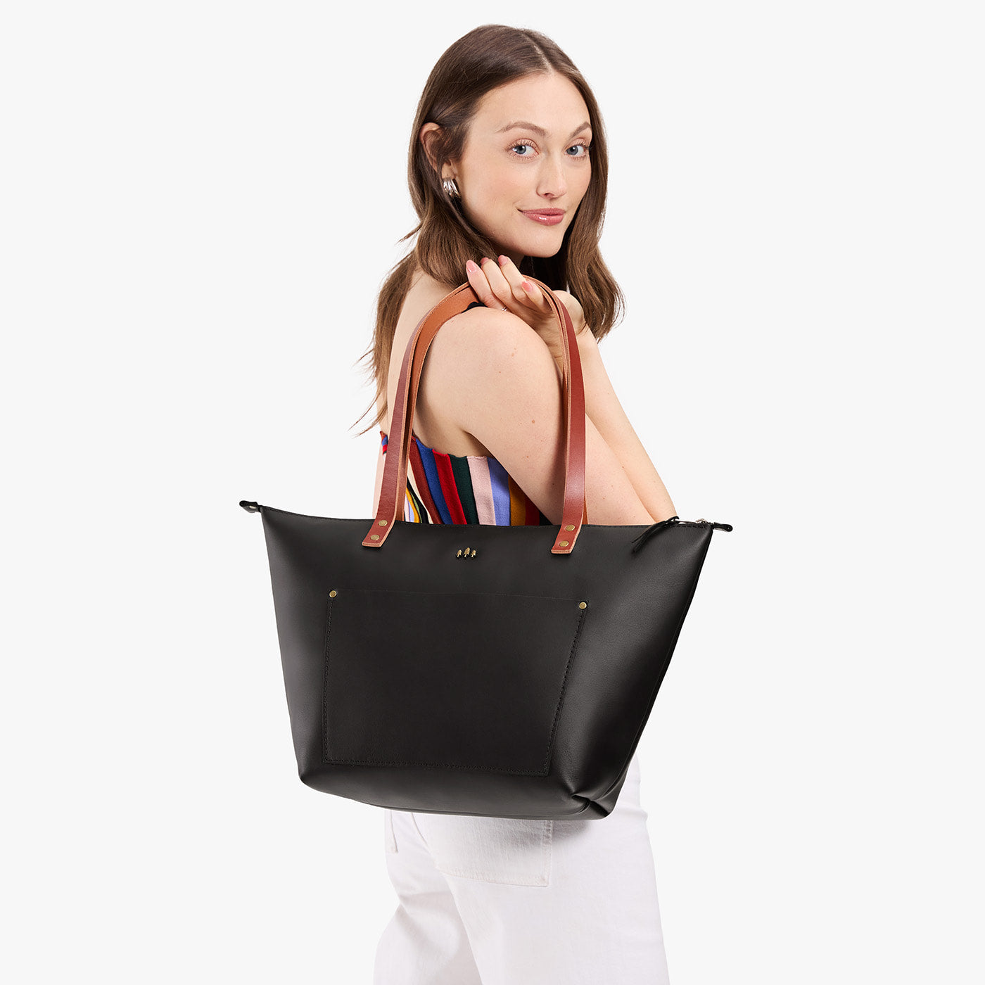 Black*Zipper | Leather Tote Bag with bridle leather handles held by a model