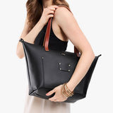 Black Zipper | Leather Tote Bag with bridle leather handles and monogram plate being held by a model