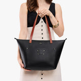 Black Zipper | Leather Tote Bag with bridle leather handles and monogram plate being held by a model
